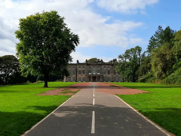 Tree-lined drive leading to Haigh Hall in Haigh Woodland Park, Wigan