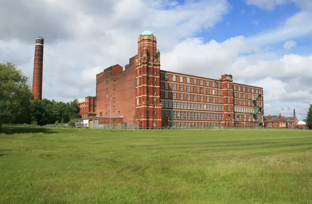 Butts Mill, a red-brick former cotton mill and chimney in Leigh